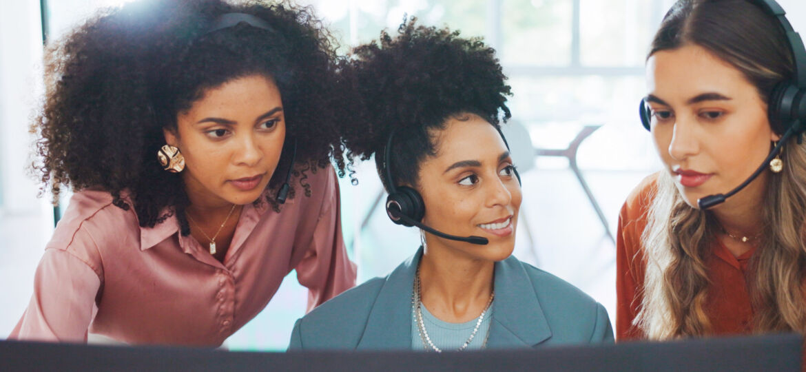 Business, women and call center with employee, manager and conversation for process, system and workplace. Female agents talking, headset and coworkers for customer support, telemarketing and support