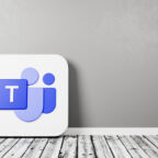 Microsoft Teams Logo 3D Symbol Shape on Wooden Floor Against Gray Wall with Copy Space 3D Render Illustration