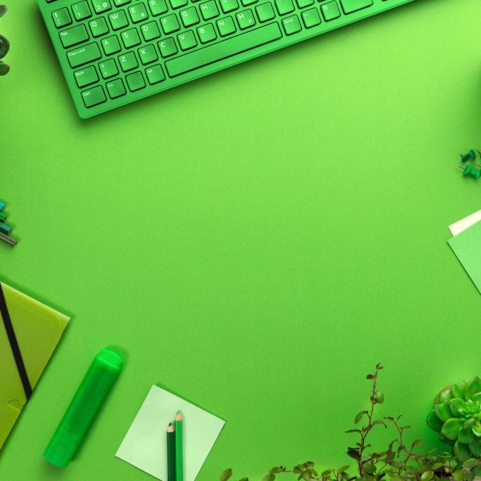 Environmental concept of a green office desk with supplies